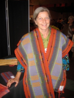 After being awarded Most Interesting Handwoven Piece at the 2010 Five Counties competition, a Guild member wears her winning table runner.