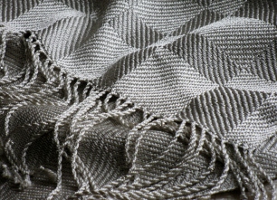 This silk shawl is woven in twill blocks.